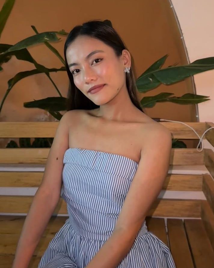 Aava Rai seated, photographed in daylight